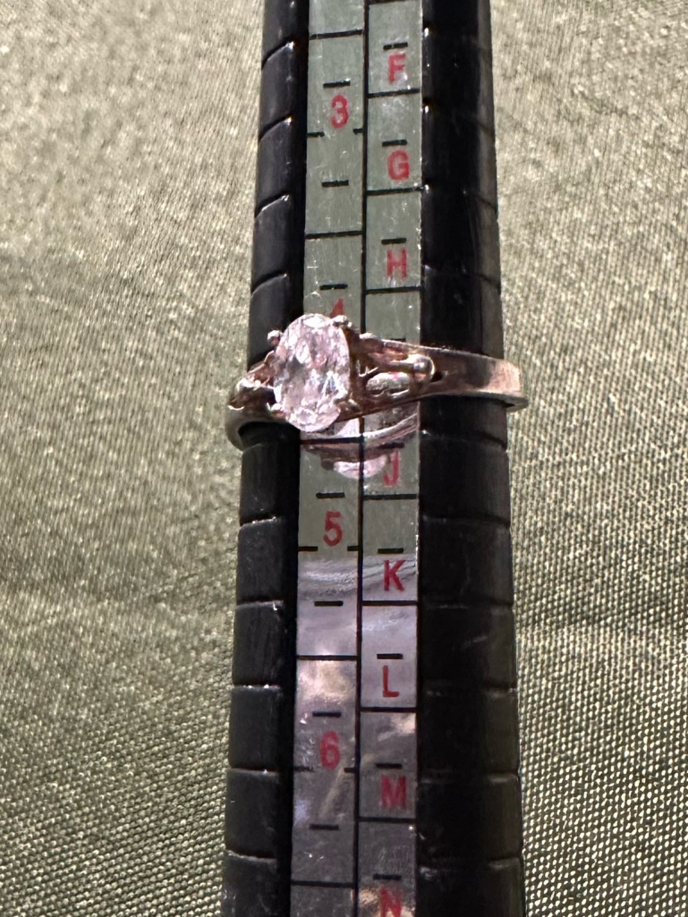 Vintage sterling silver adjustable ring with bright clear stone.